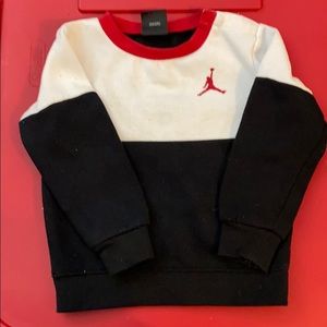 Black, red, and white Jordan sweatshirt.